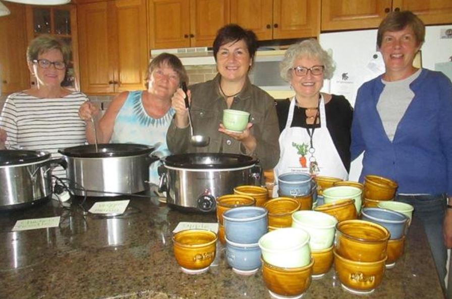 Five Women eating The Raw Carrot soup to celebrate the Super Bowl.